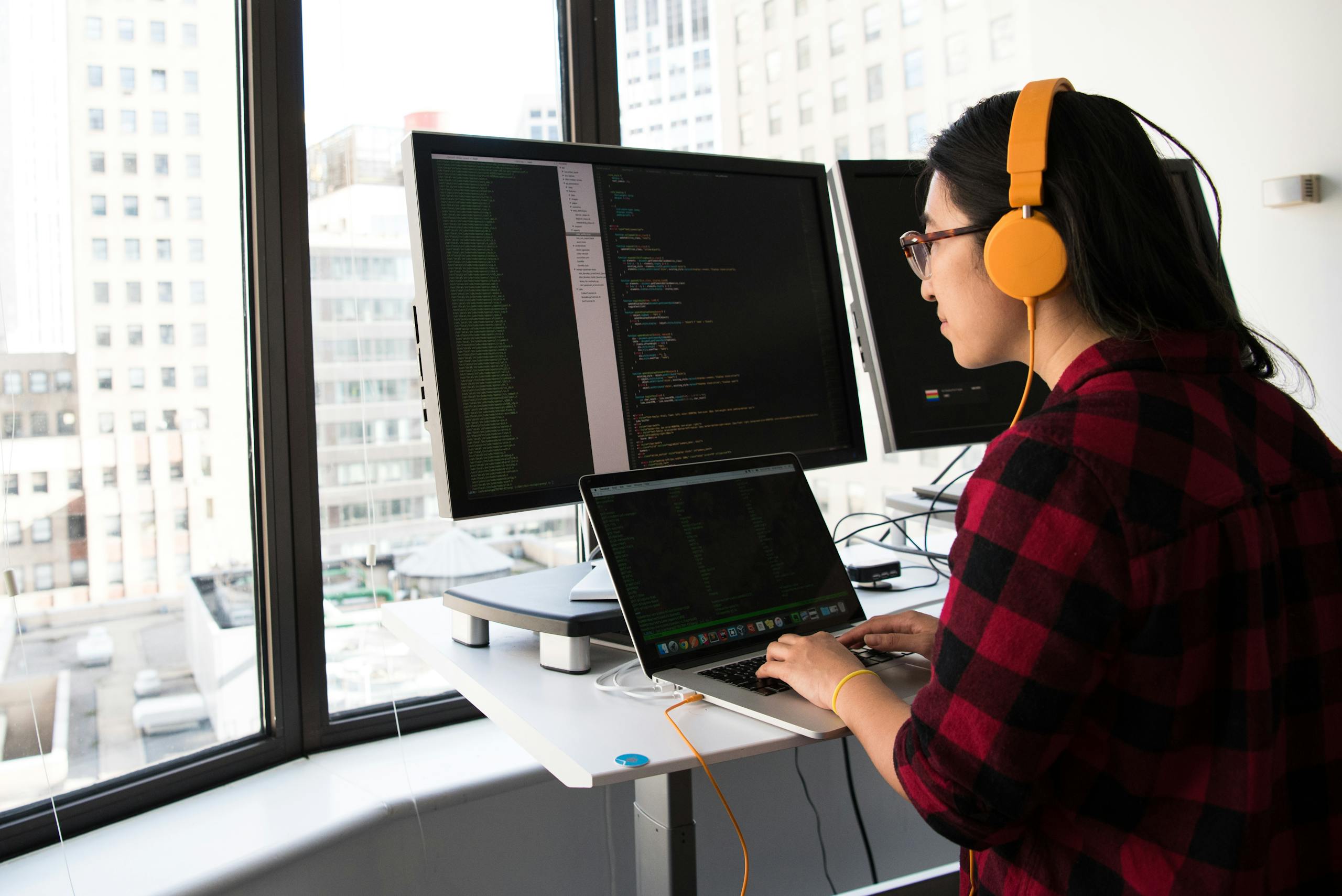 Woman Sitting in Front Laptop searching for coding bootcamps