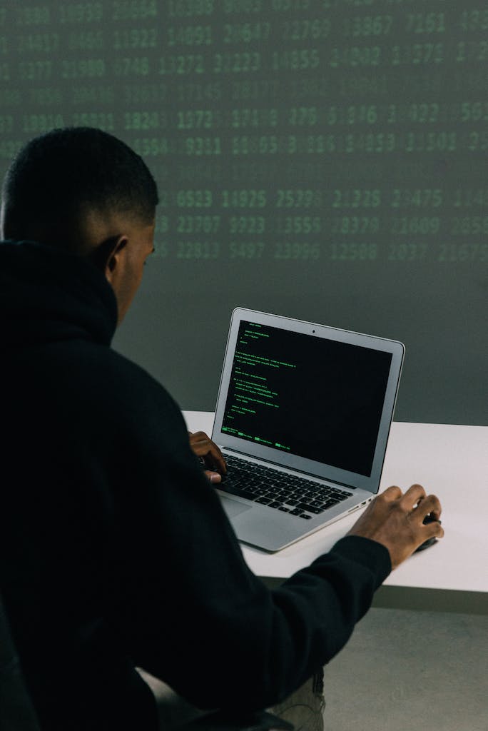 Man in Black Hoodie Using Macbook Air to learn data structures and algorithms