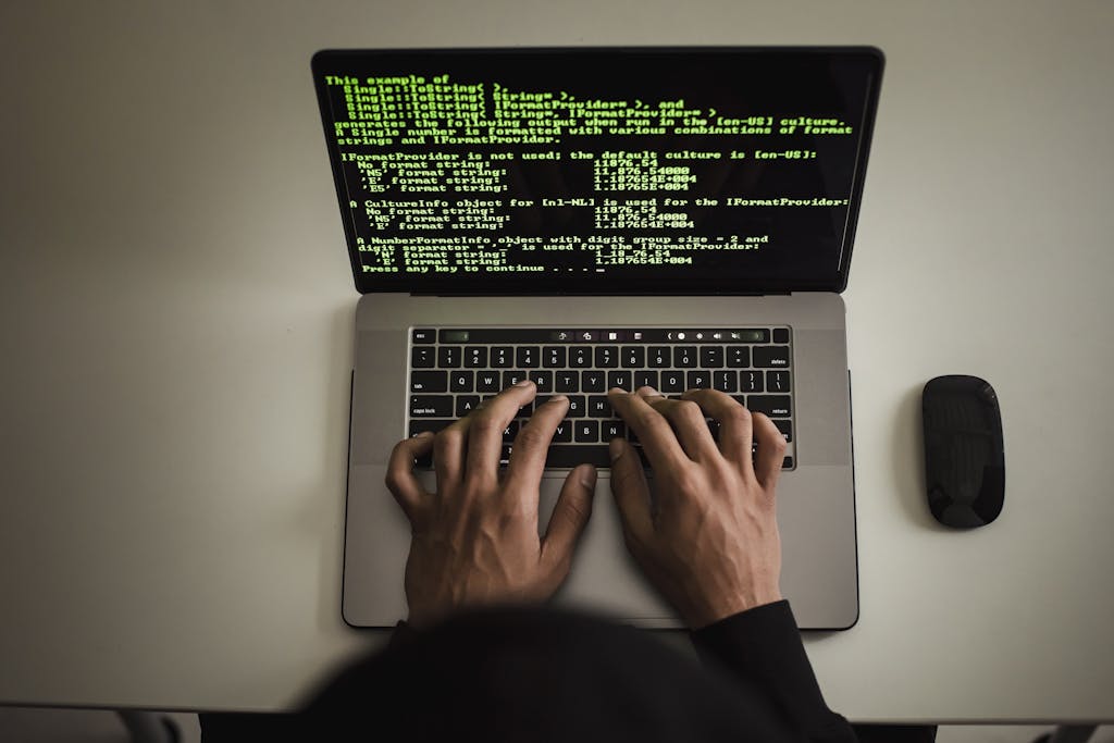 The Top 5 In-Demand Tech Careers in 2025 2 someone typing code on a laptop (In-demand tech careers)