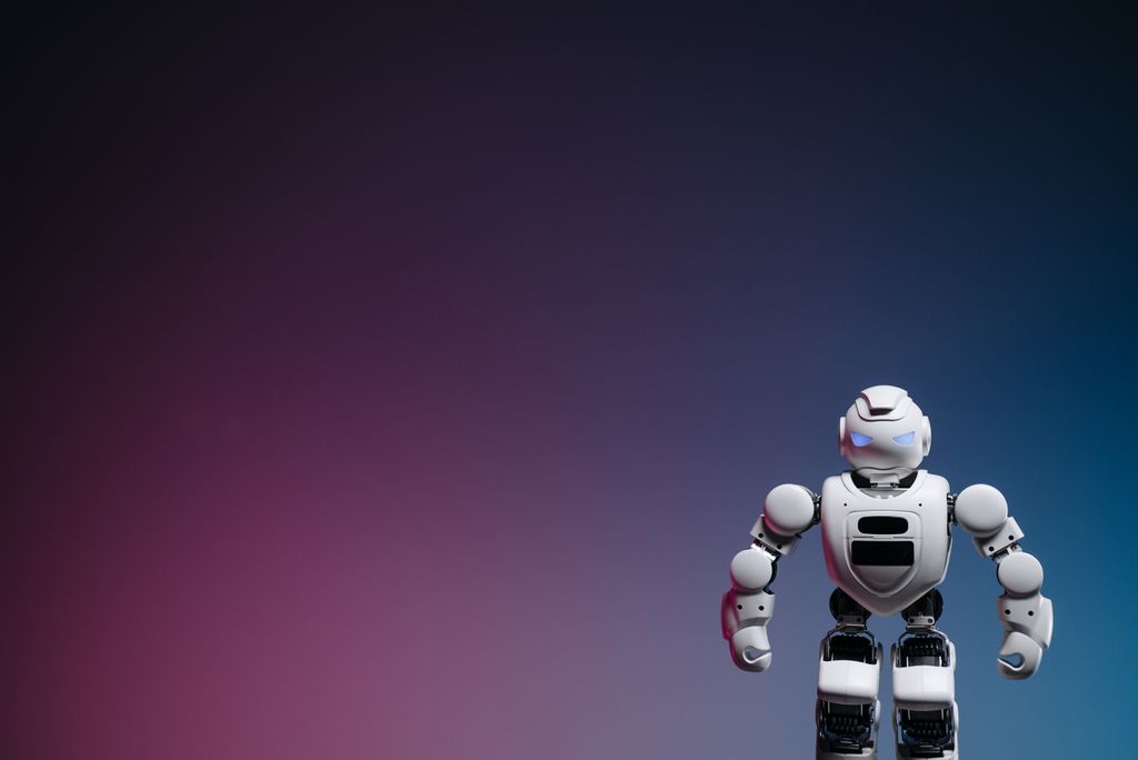 AI Workflow Automation Course 4 A sleek modern robot toy standing against a colorful gradient backdrop, offering ample copy space. AI Workflow Automation robot concept.