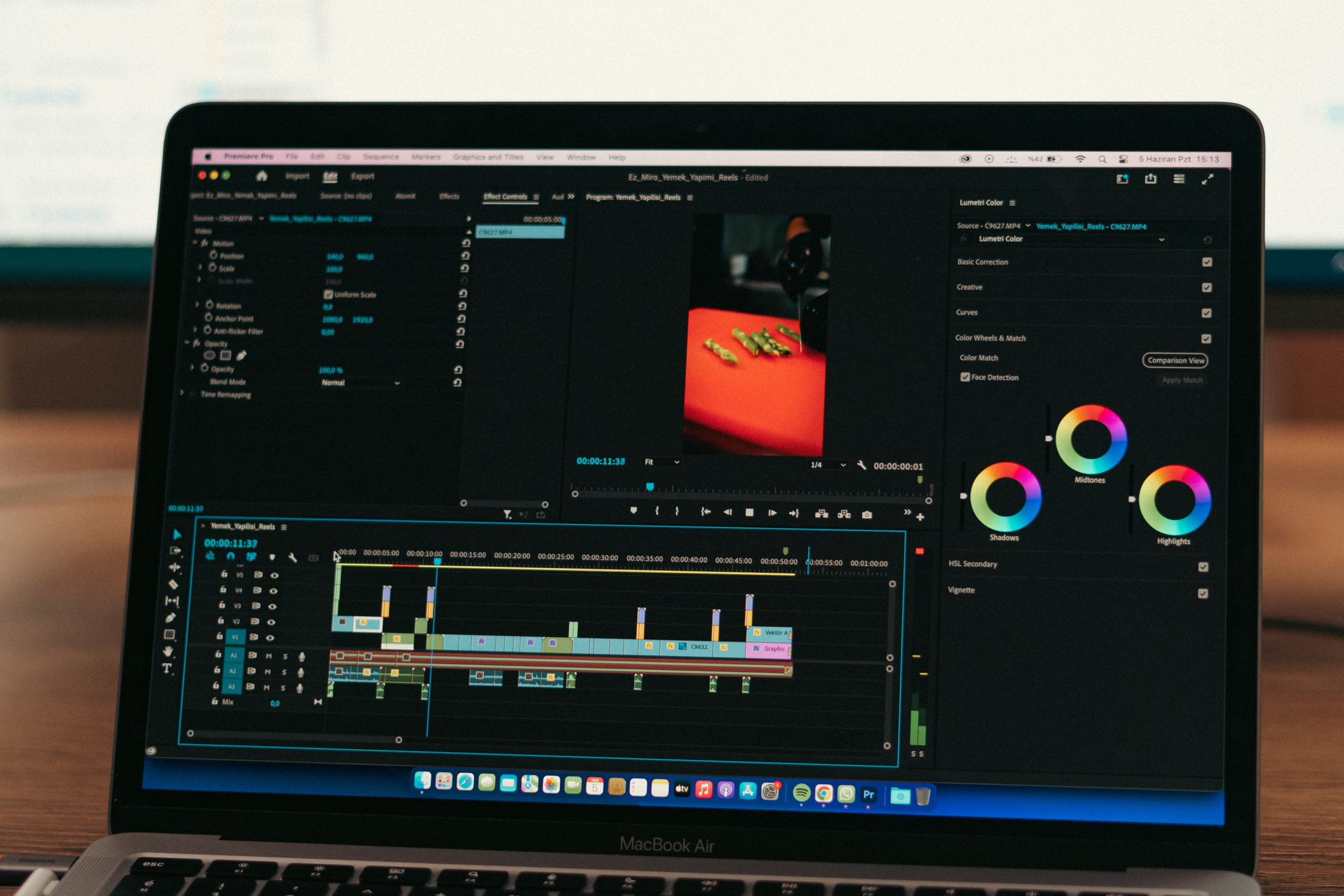 AI Workflow Automation Course 1 Close-up of video editing software on a laptop screen in a professional setting.