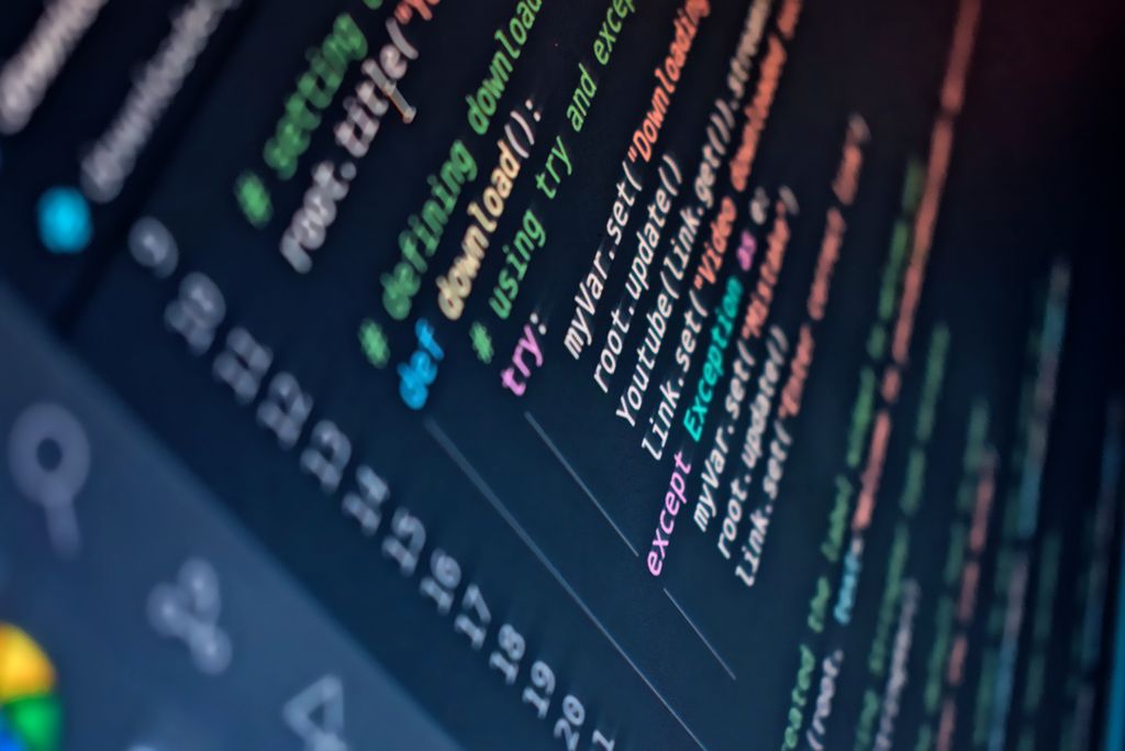 Python Programming Course 1 Close-up of a computer screen displaying colorful programming code with depth of field.